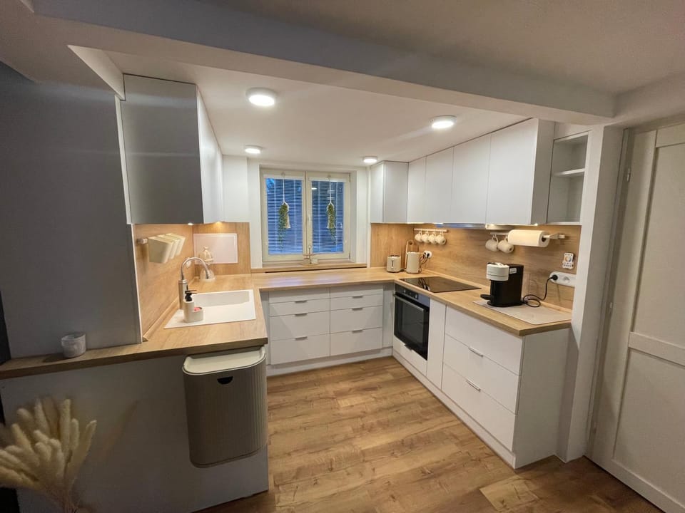 Kitchen or kitchenette, dishwasher, oven, stove, toaster