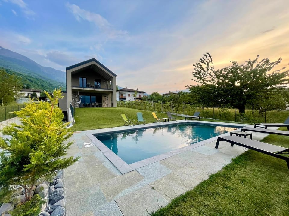 Property building, Natural landscape, Garden, Swimming pool, Sunset