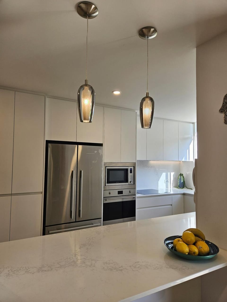 Kitchen or kitchenette, dishwasher, oven, stove