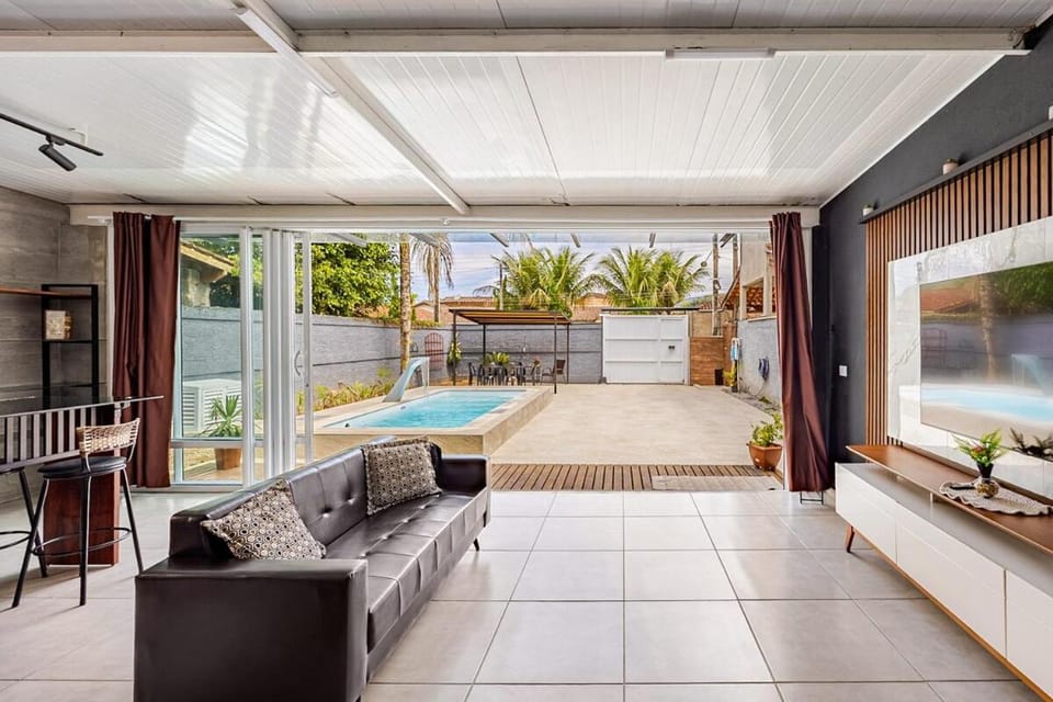 Communal lounge/ TV room, TV and multimedia, View (from property/room), Seating area, Pool view, Swimming pool