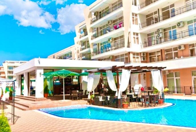 Property building, Patio, Day, View (from property/room), Evening entertainment, Swimming pool, sunbed
