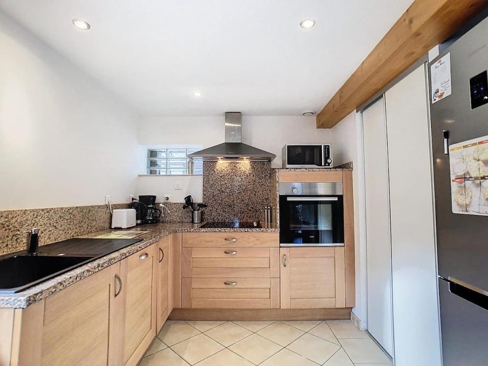 Kitchen or kitchenette, dishwasher, oven, stove, toaster