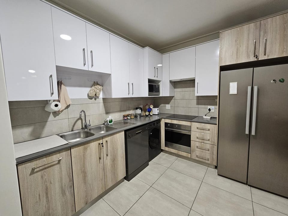 Kitchen or kitchenette, dishwasher, oven, stove, toaster