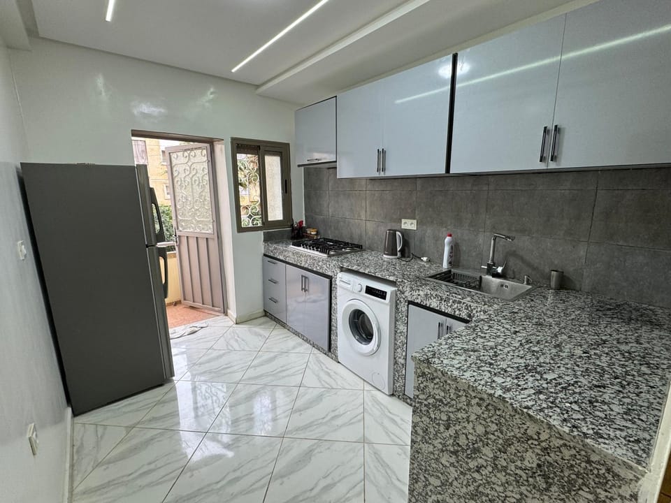 Kitchen or kitchenette, oven, stove, washing machine, dryer