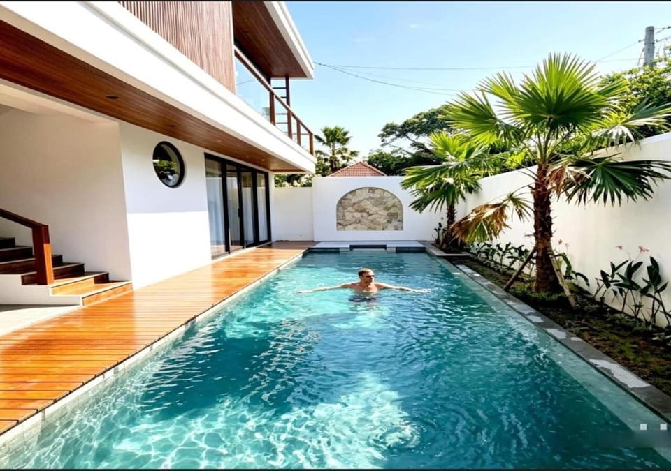 Property building, Patio, Day, People, Natural landscape, Pool view, Swimming pool