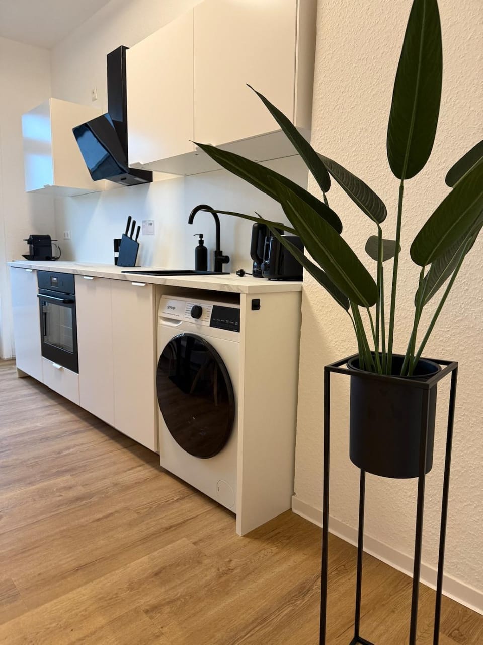 Kitchen or kitchenette, dishwasher, stove, toaster, washing machine, dryer