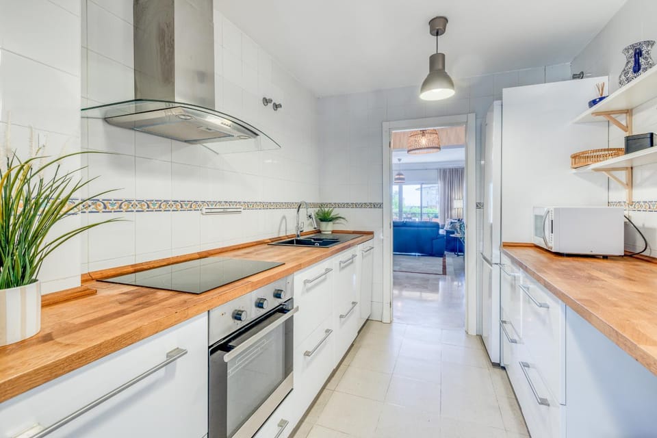 Kitchen or kitchenette, dishwasher, oven, stove
