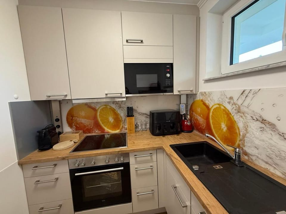 Kitchen or kitchenette, dishwasher, oven, stove, toaster