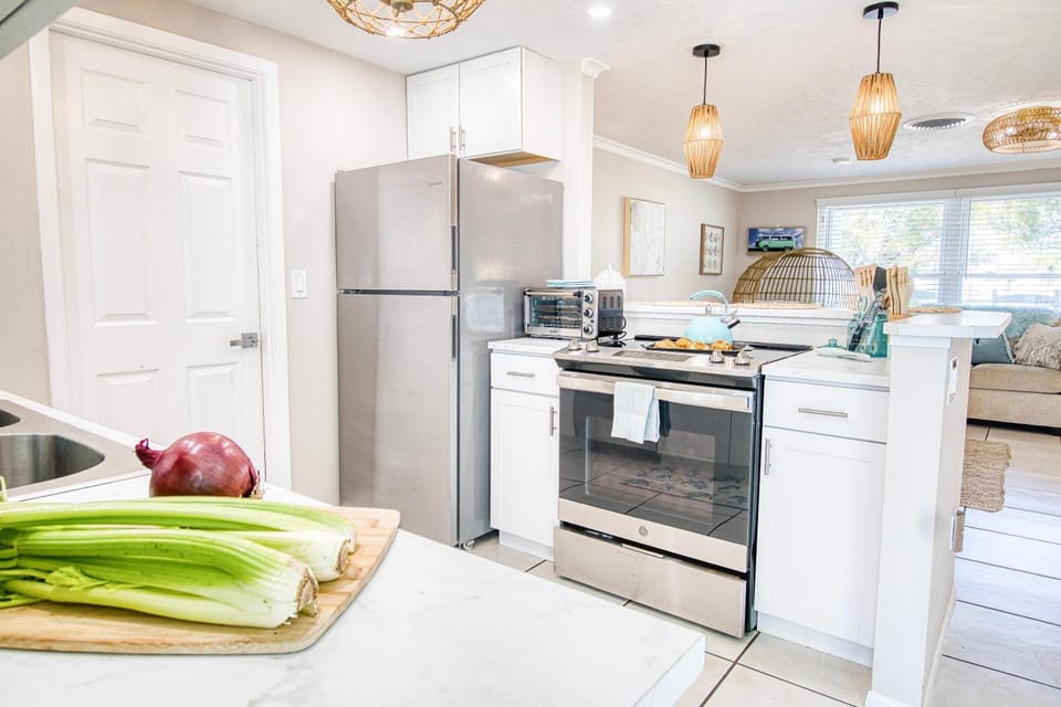 Kitchen or kitchenette, dishwasher, oven, stove, toaster