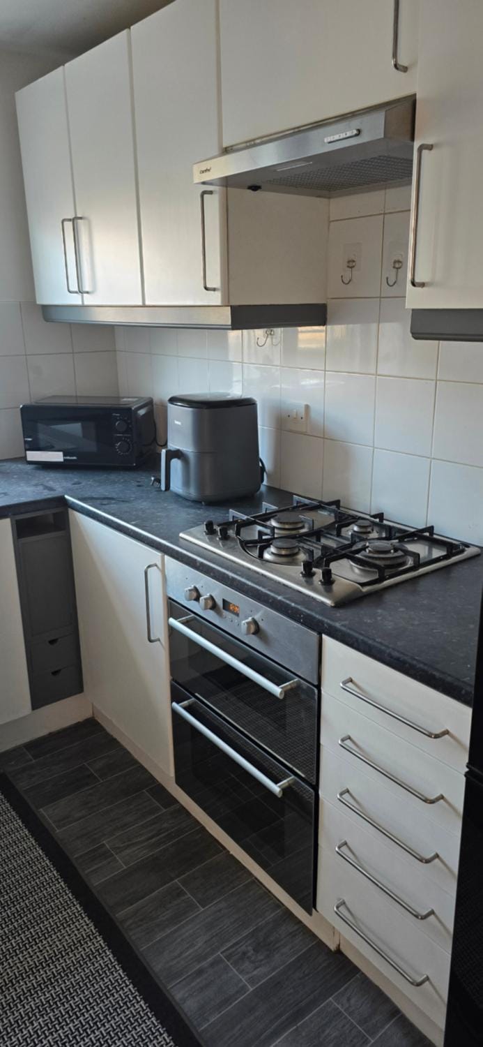 Kitchen or kitchenette, stove, toaster