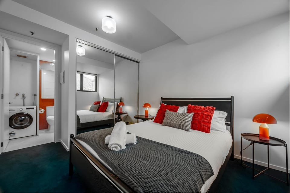 Bed, towels, wardrobe