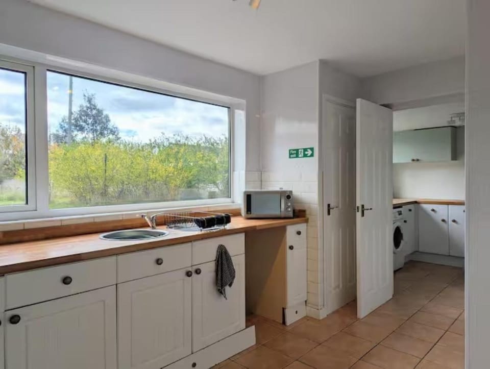 Kitchen or kitchenette, dishwasher, washing machine, dryer