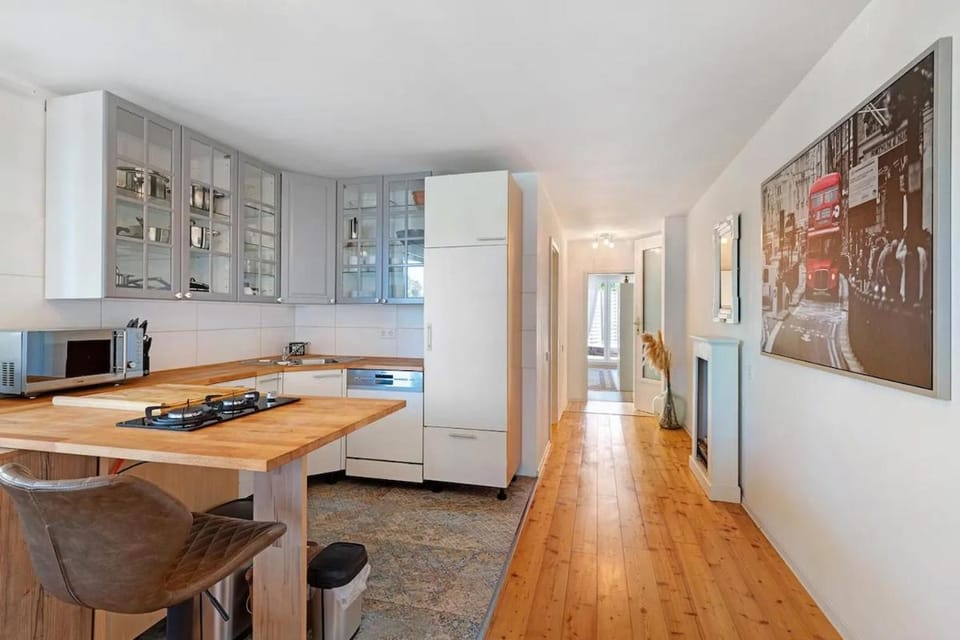 Kitchen or kitchenette, dishwasher, oven, stove