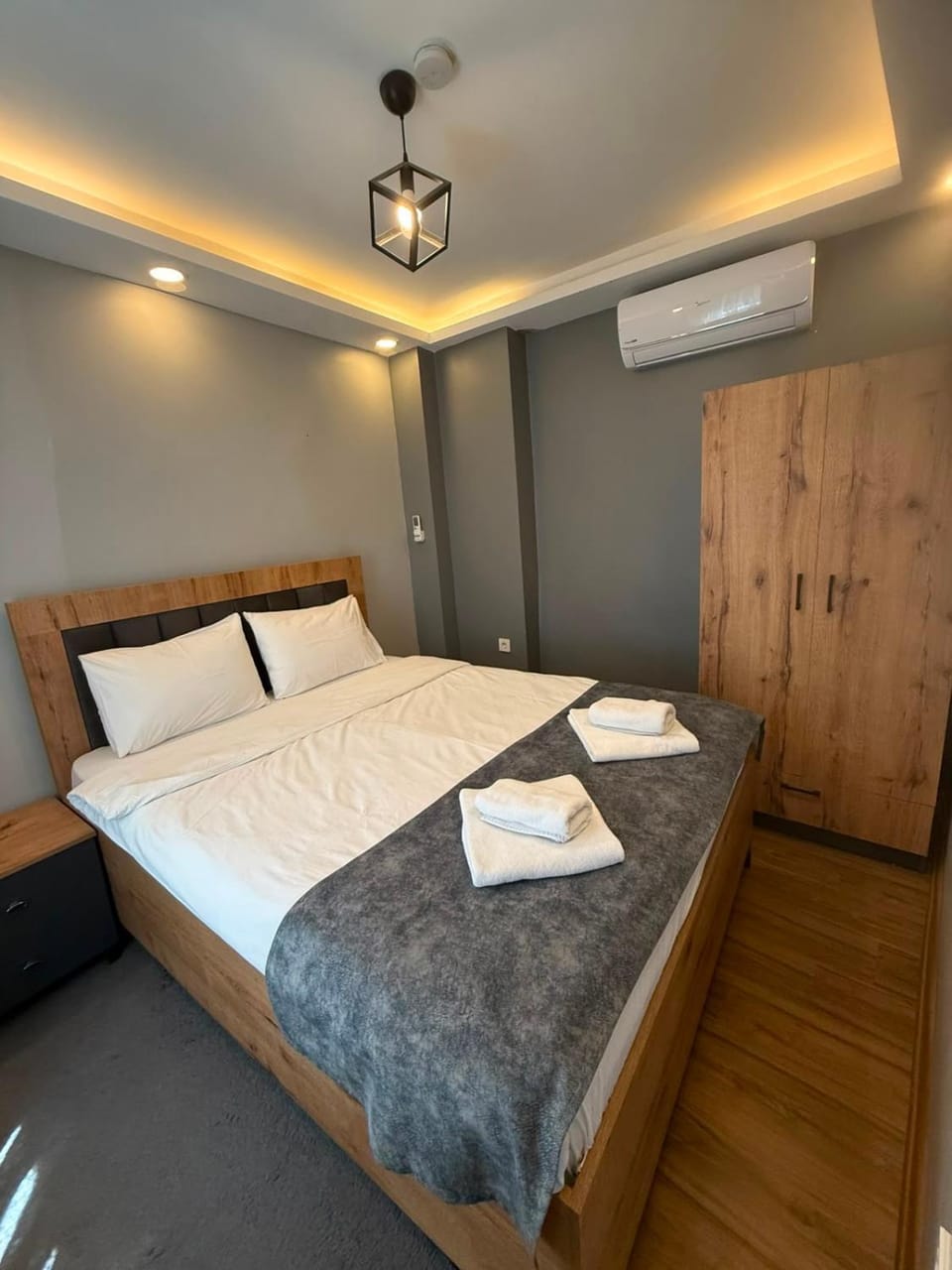 Bed, Bedroom, towels, wardrobe, air conditioner