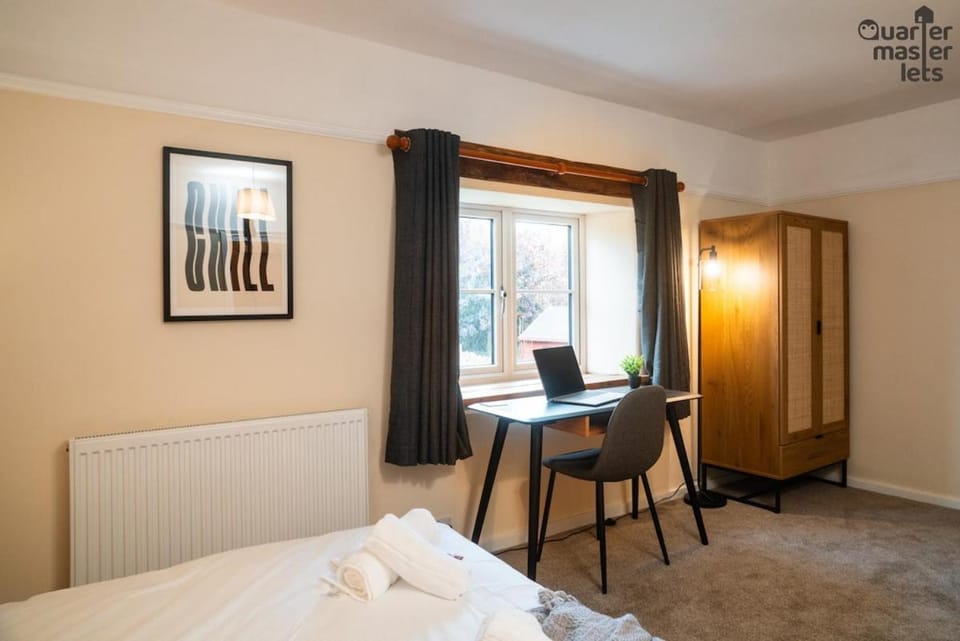 Bed, Decorative detail, Seating area, Bedroom, Garden view, fireplace, furniture, heating, internet, storage, towels, wardrobe, laundry