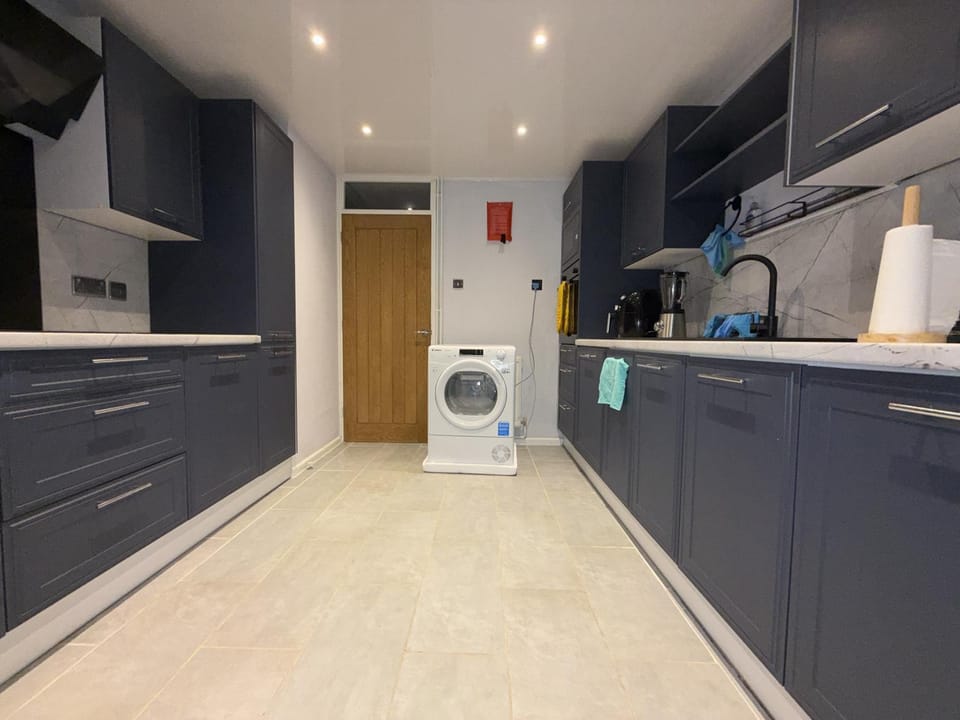 Kitchen or kitchenette, dishwasher, stove, washing machine, dryer