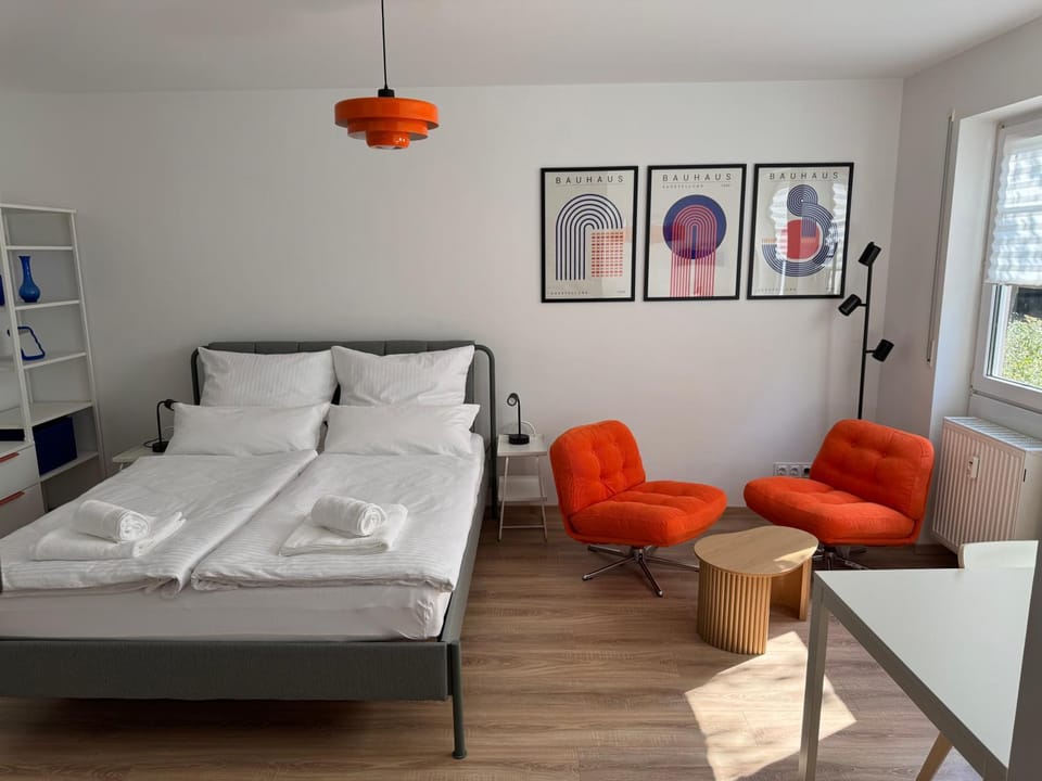 Bed, Living room, Seating area, Bedroom