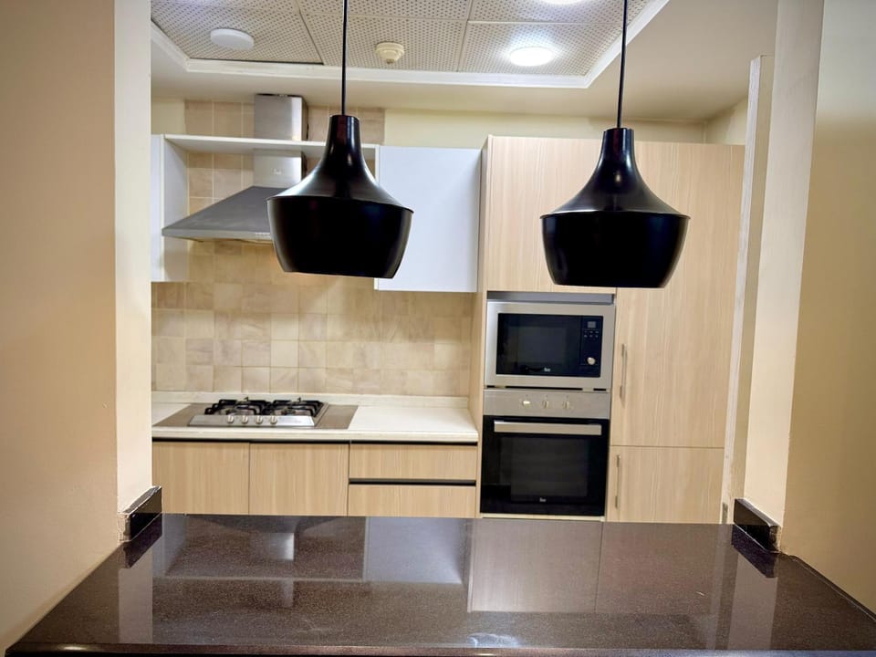 Kitchen or kitchenette, oven, stove