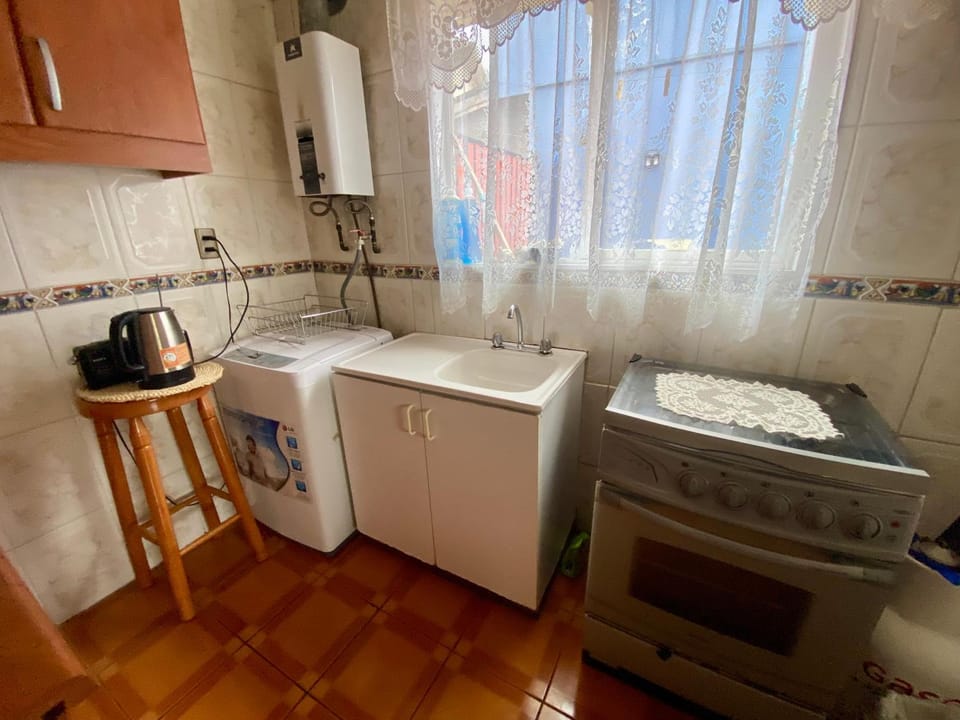 Kitchen or kitchenette, stove, washing machine