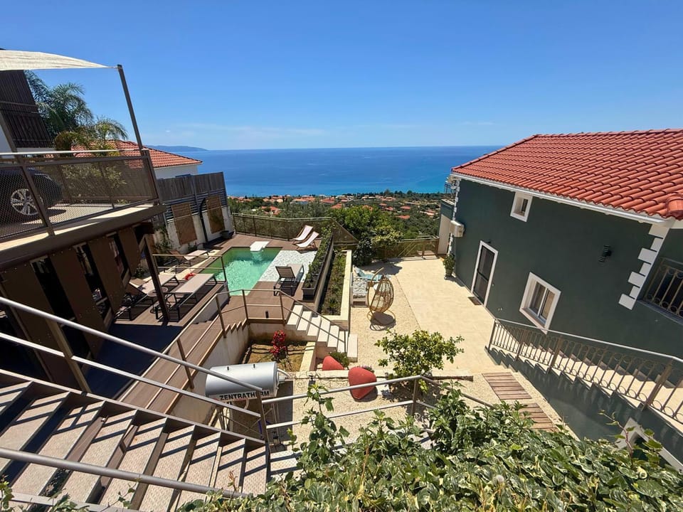 Property building, Patio, Day, Natural landscape, View (from property/room), Balcony/Terrace, Sea view, Swimming pool, sunbed