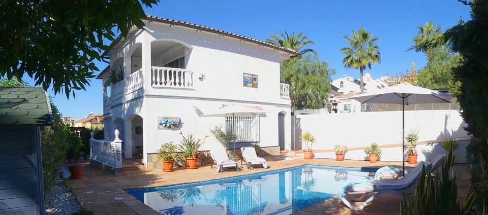 Property building, Living room, Swimming pool
