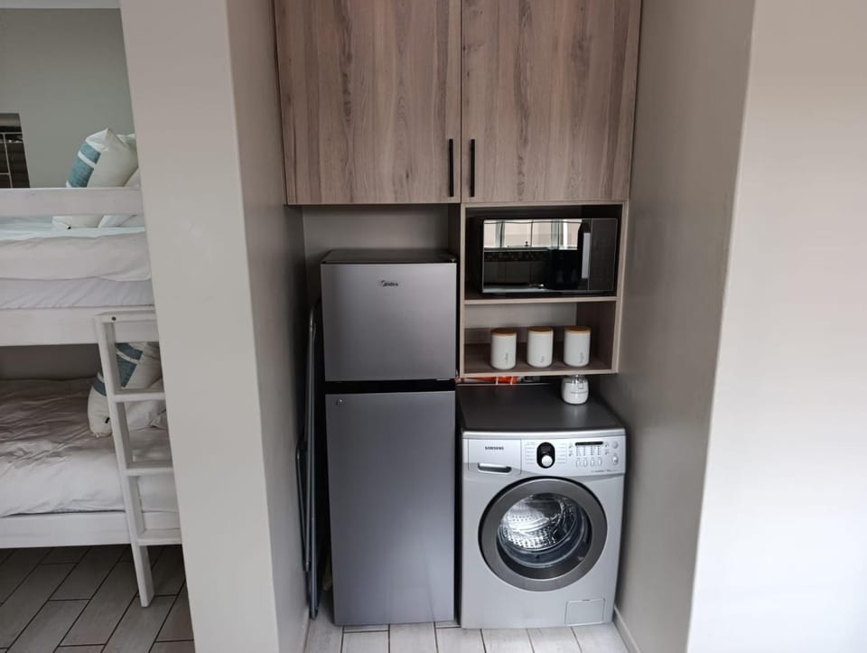 Kitchen or kitchenette, washing machine