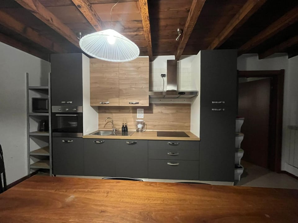 Kitchen or kitchenette, dishwasher, microwave, oven