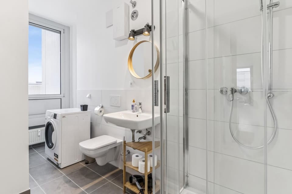 Shower, Toilet, Bathroom, flat iron, hair dryier, towels, washing machine, dryer