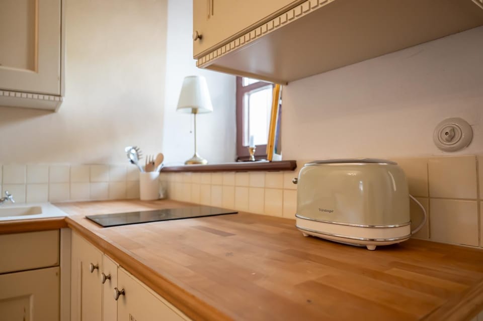 Kitchen or kitchenette, stove, toaster