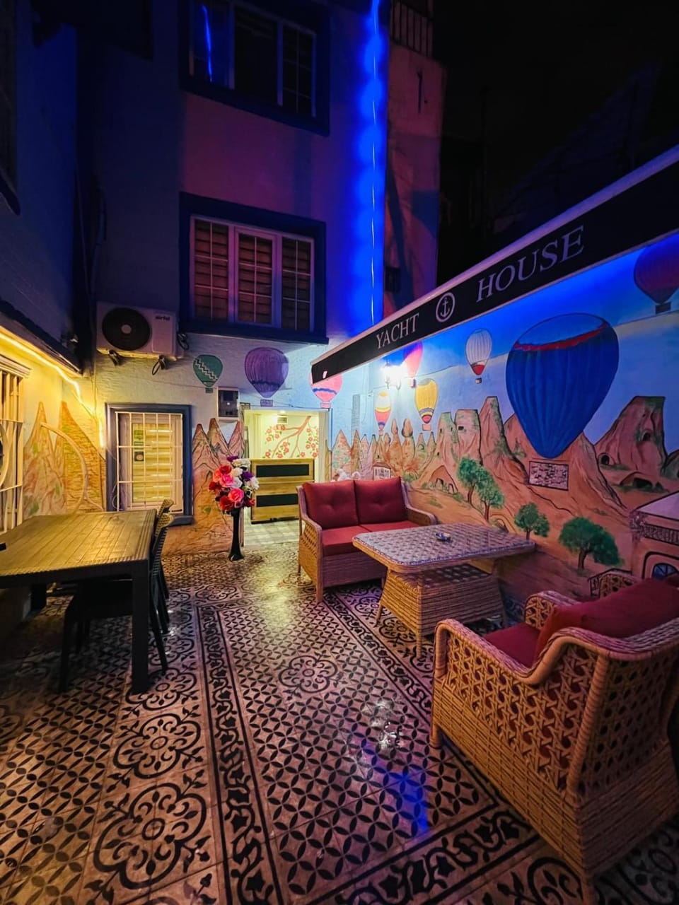 Patio, Communal lounge/ TV room, Night, Nightclub / DJ, Living room, Seating area, Evening entertainment