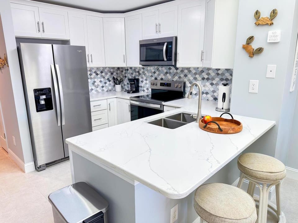 Kitchen or kitchenette, dishwasher, oven, stove, toaster