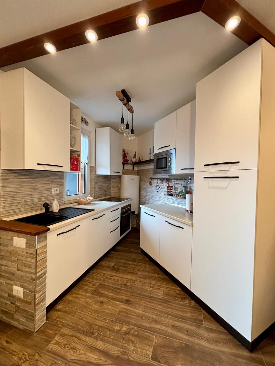 Kitchen or kitchenette, dishwasher, oven, stove