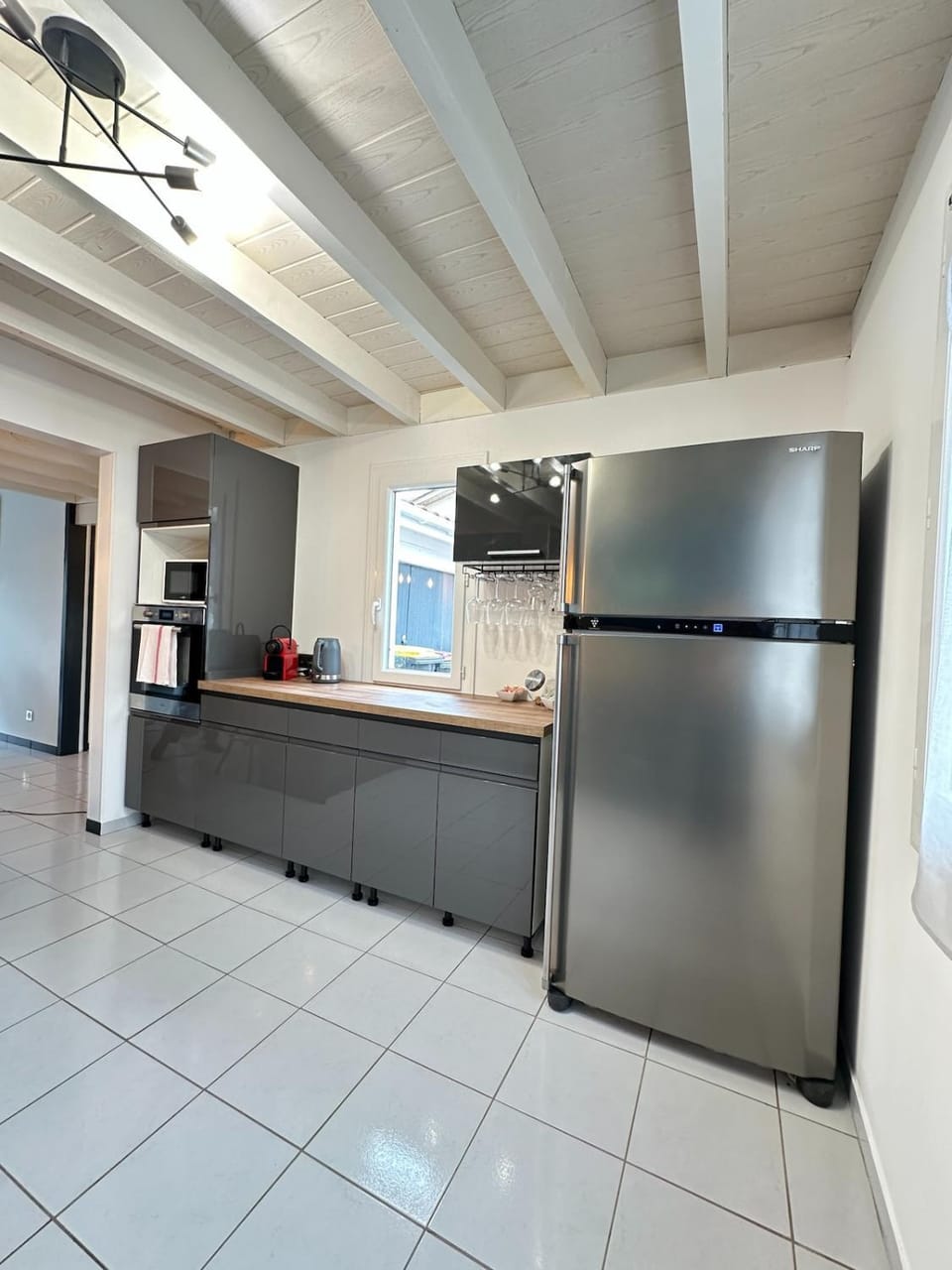 Kitchen or kitchenette, dishwasher, oven, stove