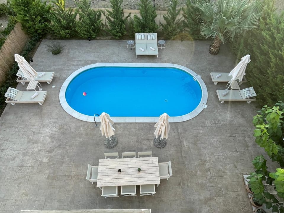 Patio, Day, Natural landscape, Pool view, Swimming pool, sunbed