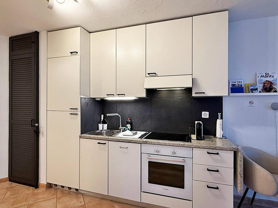 Kitchen or kitchenette, dishwasher, oven, stove