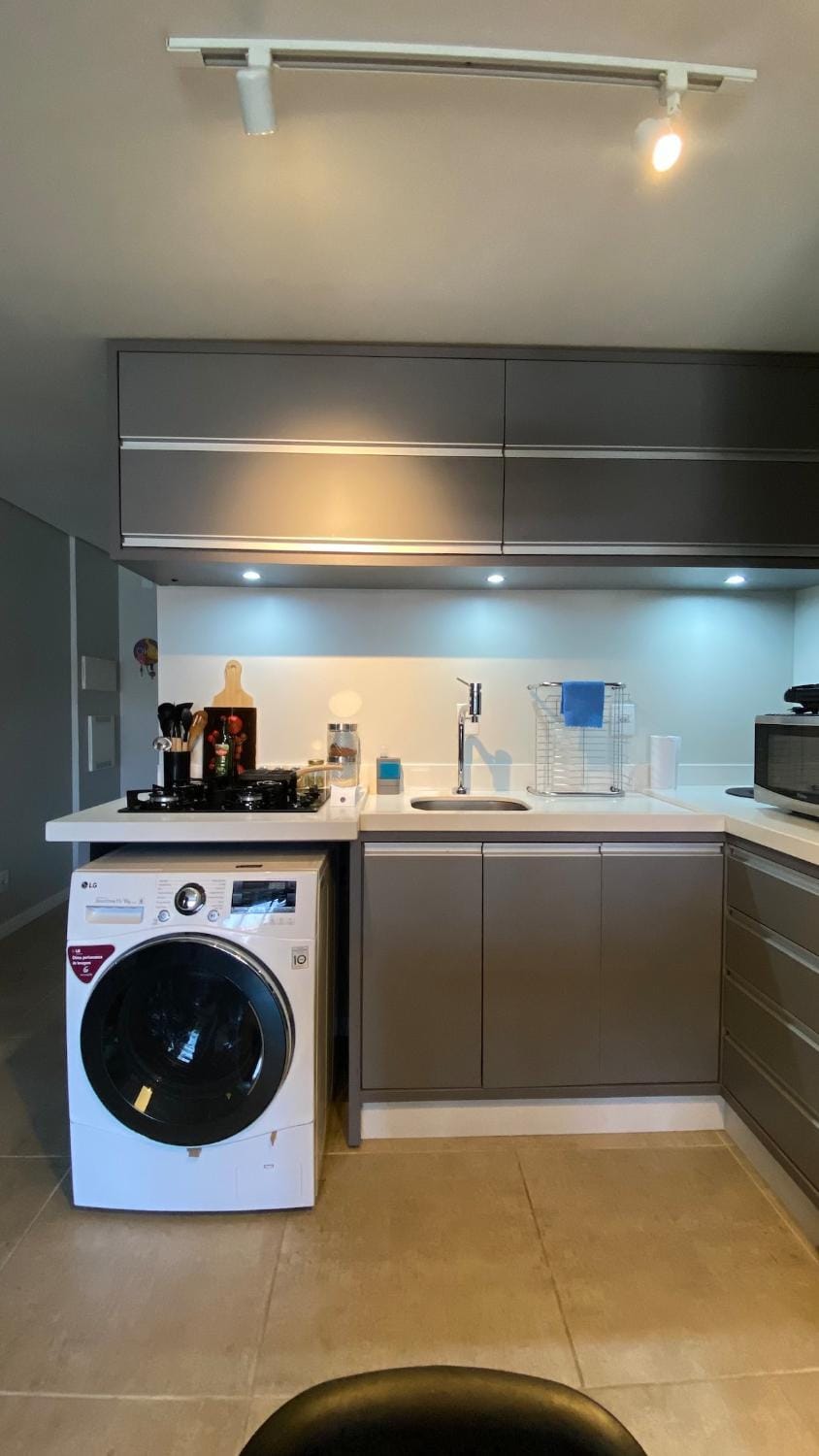 Kitchen or kitchenette, stove, washing machine, dryer