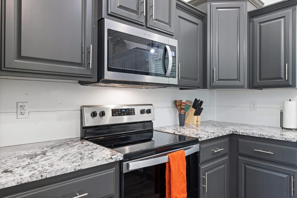 Kitchen or kitchenette, dishwasher, oven, stove, toaster