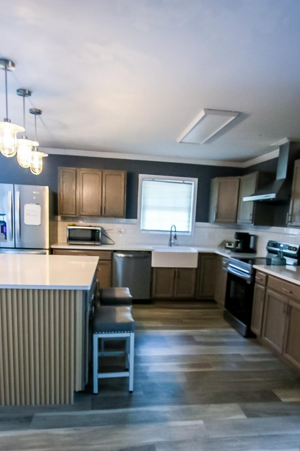 Kitchen or kitchenette, dishwasher, oven, stove