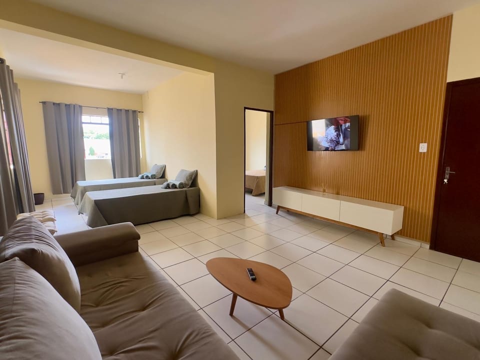 Communal lounge/ TV room, Bed, TV and multimedia, Living room, Photo of the whole room, Seating area, Bedroom
