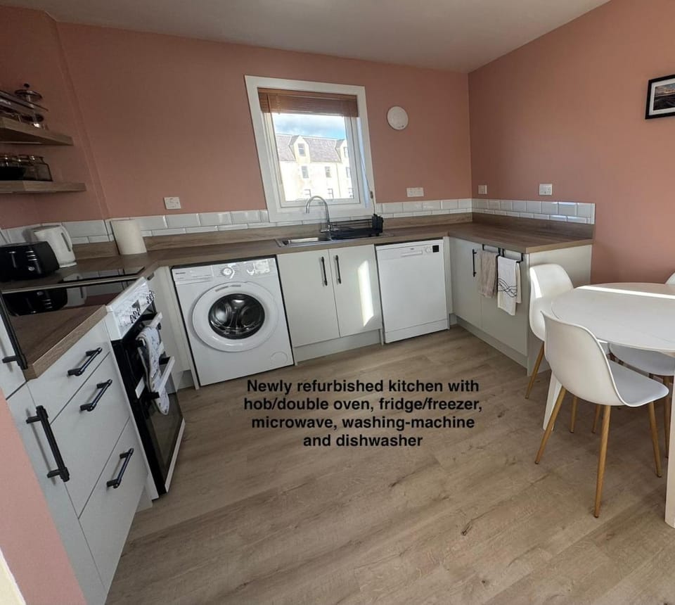 Kitchen or kitchenette, Dining area, dishwasher, oven, stove, washing machine