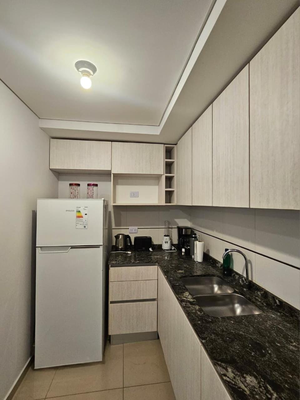 Kitchen or kitchenette, dishwasher, oven, stove