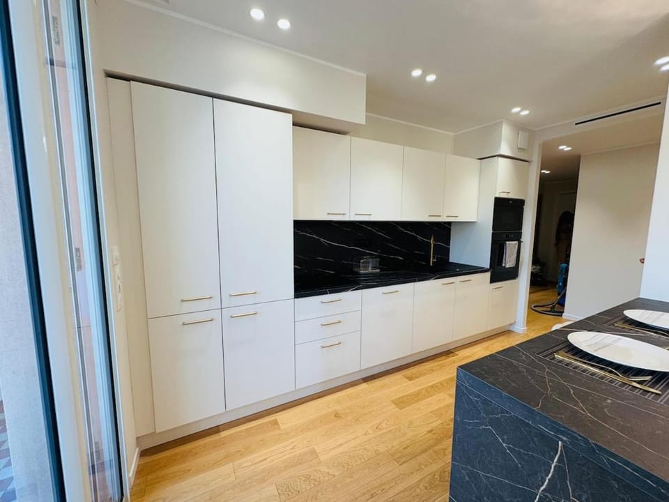 Kitchen or kitchenette, dishwasher, oven, stove
