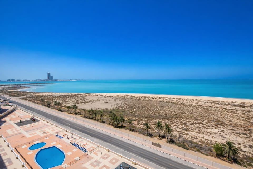 Property building, Nearby landmark, Day, Natural landscape, Beach, Pool view, Sea view, Swimming pool