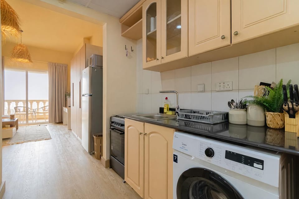 Kitchen or kitchenette, oven, stove, washing machine, kitchen