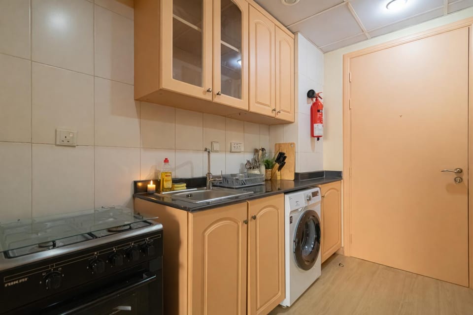 Kitchen or kitchenette, stove, washing machine