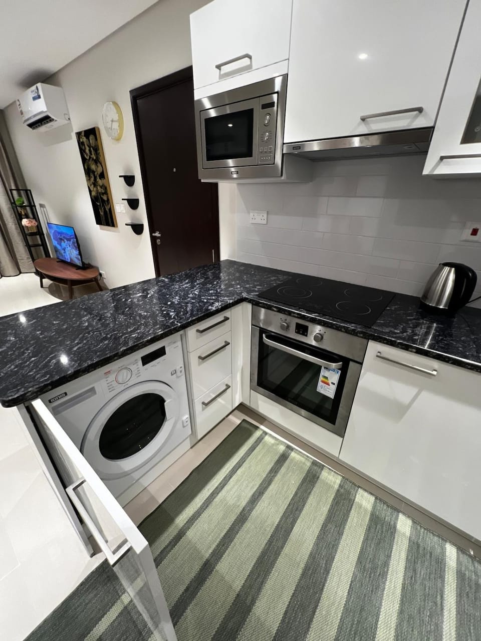 Kitchen or kitchenette, dishwasher, oven, stove, washing machine, dryer