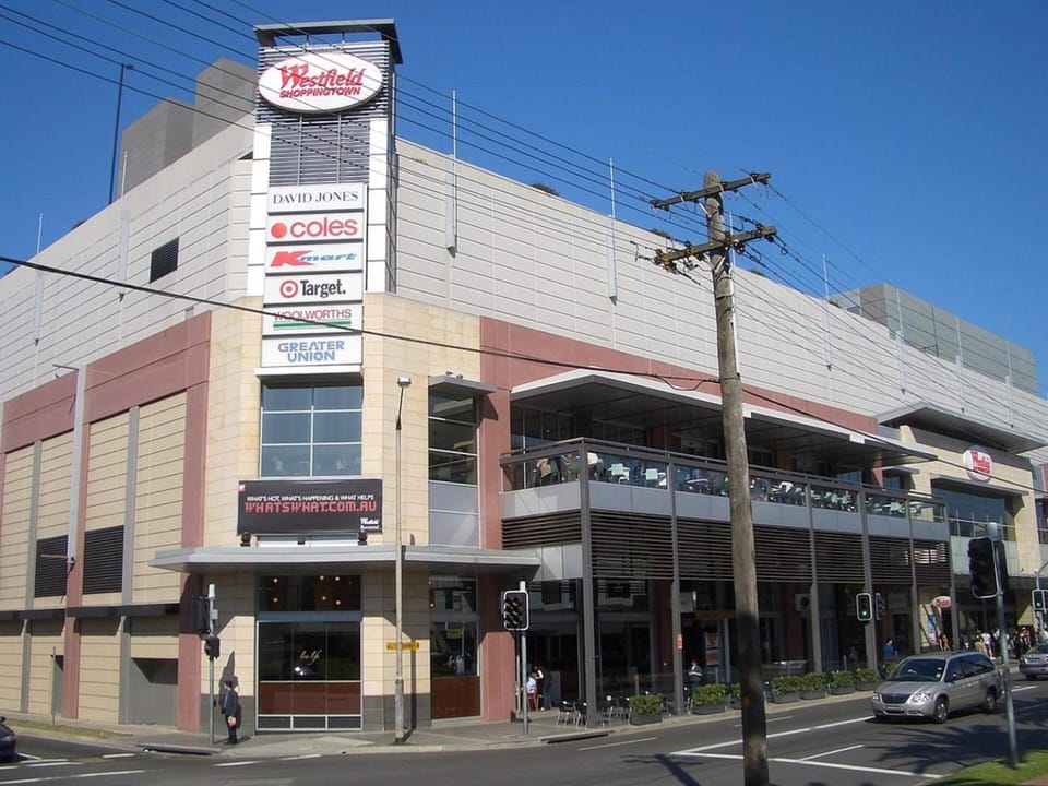 KozyGuru | Burwood | City Skyline – Steps to Train Apartment in Sydney