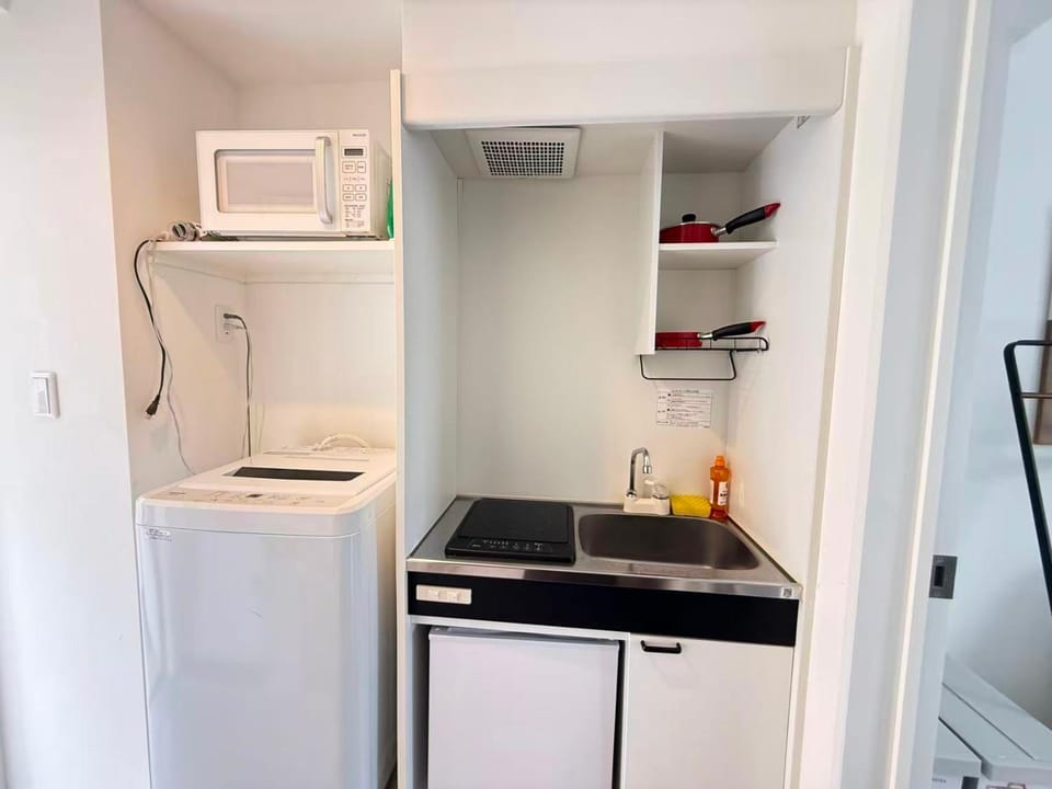 Kitchen or kitchenette, washing machine