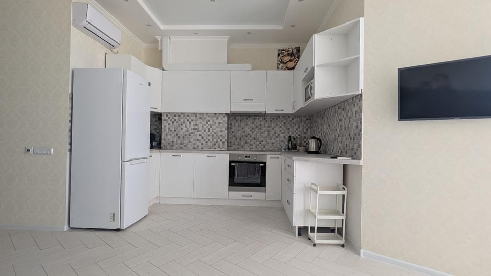 Kitchen or kitchenette, oven, stove, air conditioner