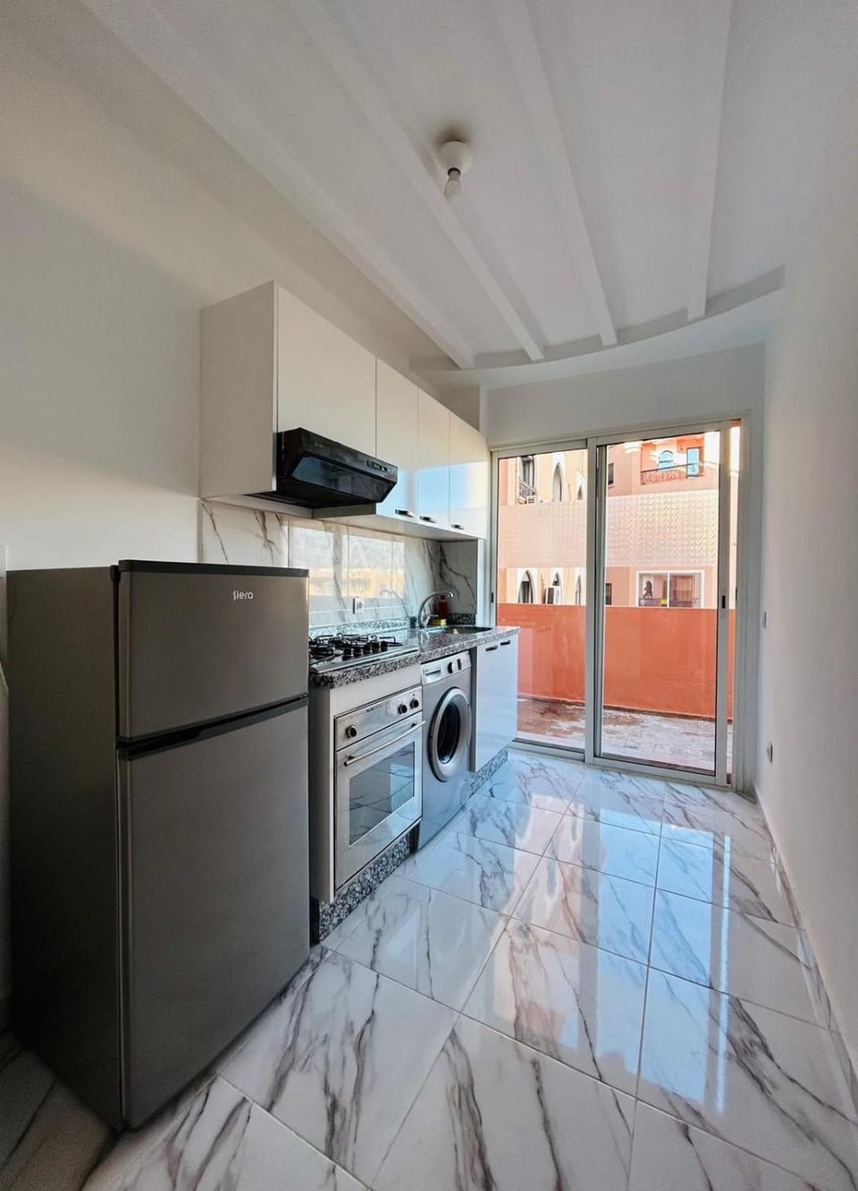 Kitchen or kitchenette, oven, stove, washing machine